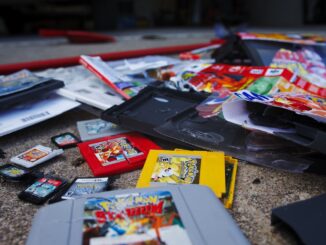 a bunch of nintendo games laying on the ground