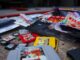 a bunch of nintendo games laying on the ground