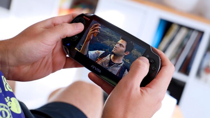 a man holding a smart phone up to his face