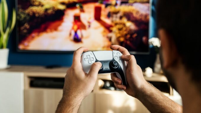 a man playing a video game on the nintendo wii