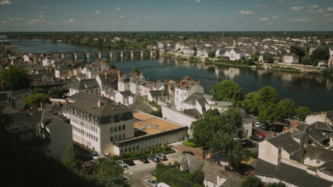 A scenic view of a european town by the river.