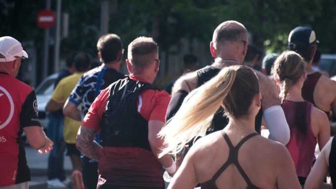 A group of people running in an urban marathon.