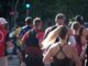 A group of people running in an urban marathon.
