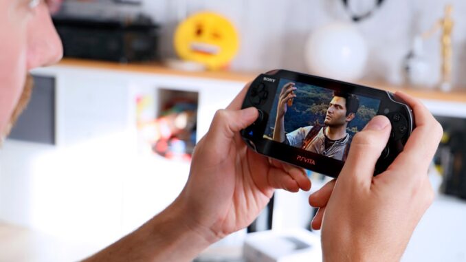 a man is playing a video game on his phone