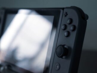 black and gray nintendo switch