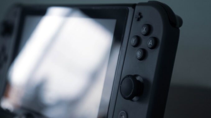 black and gray nintendo switch