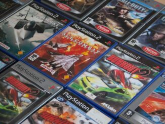 a pile of video games sitting on top of a table