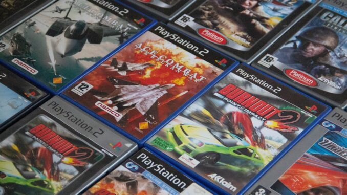 a pile of video games sitting on top of a table