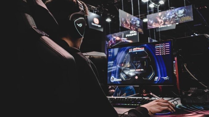 person sitting on gaming chair while playing video game
