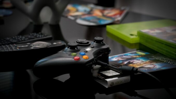 black Microsoft Xbox 360 controller