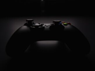 shallow focus photography of black Xbox controller