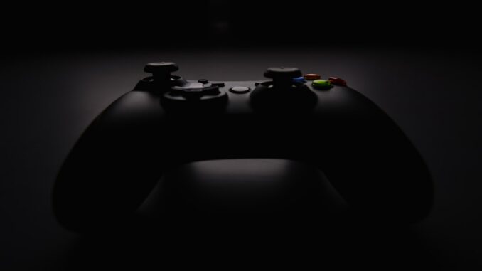 shallow focus photography of black Xbox controller