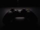 shallow focus photography of black Xbox controller