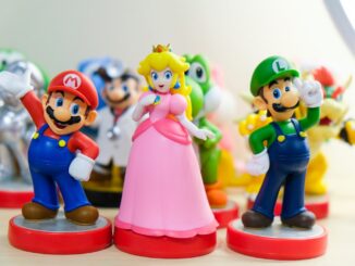 Super Mario, Luigi, and Princess Peach figurines