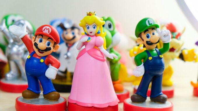 Super Mario, Luigi, and Princess Peach figurines