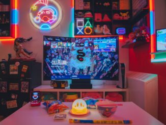 a living room with a large television and neon lights